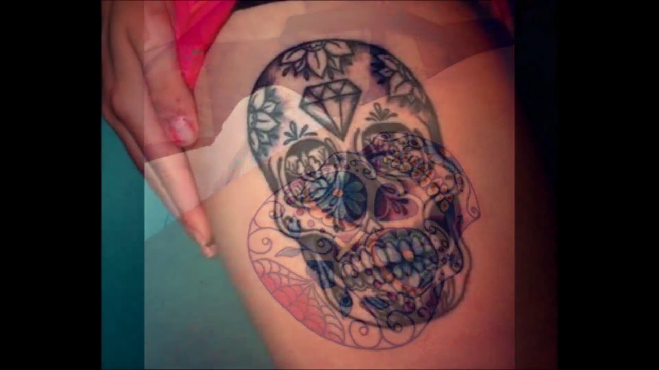 tatuajes de calaveras en la pierna para mujer